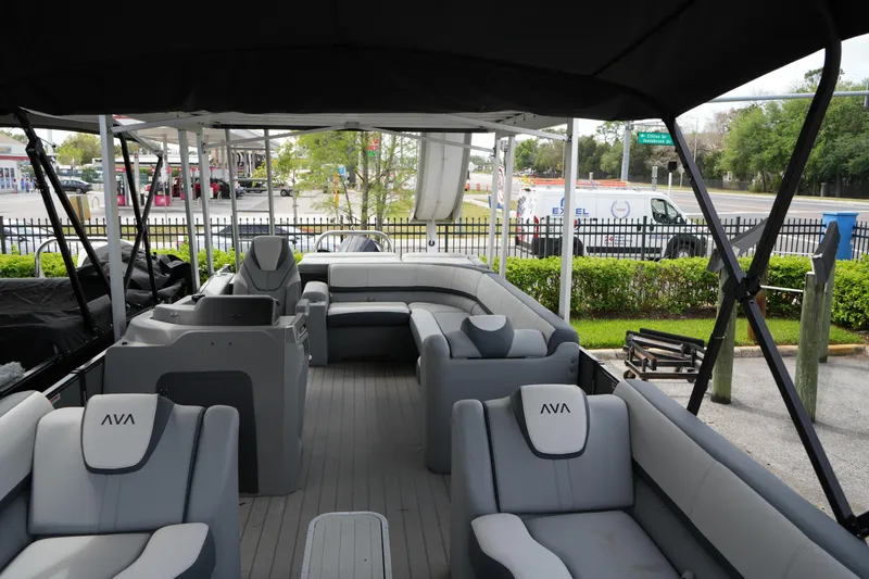 Slide: The Image of 2026 Avalon Catalina Cruise Funship - 27' pontoon boat interior with gray seating and canopy. - 12