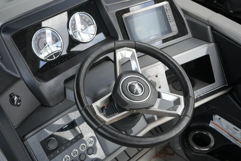 Slide: The Image of Steering console of 2026 Avalon Catalina Cruise Funship, featuring modern gauges and controls. - 21