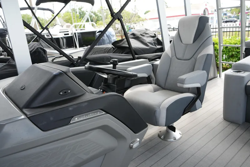 Slide: The Image of Captain's chair and helm of 2026 Avalon Catalina Cruise Funship 27' boat. - 24