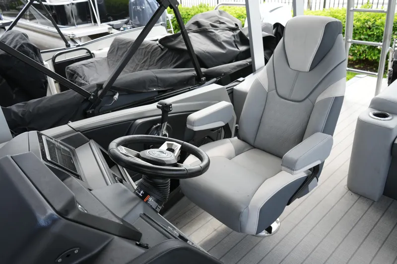 Slide: The Image of Captain's chair and helm of 2026 Avalon Catalina Cruise Funship pontoon boat. - 25