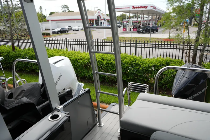 Slide: The Image of 2026 Avalon Catalina Cruise Funship boat with Mercury engines near a Speedway gas station. - 28