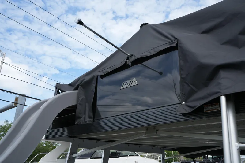 Slide: The Image of 2026 Avalon Catalina Cruise Funship with canopy and slide, under a blue sky. - 29
