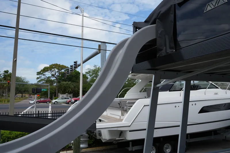 Slide: The Image of 2026 Avalon Catalina Cruise Funship with slide, parked near a road intersection. - 30