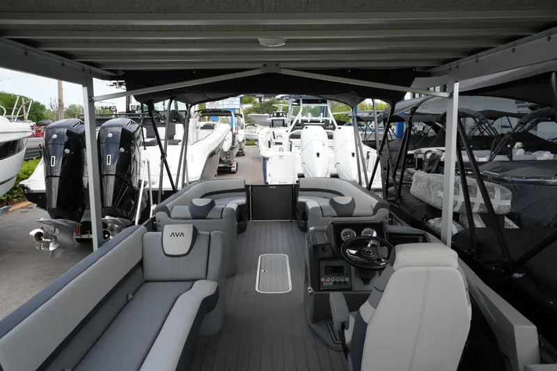 Slide: The Image of 2026 Avalon Catalina Cruise Funship 27' pontoon boat interior with seating and steering console. - 33