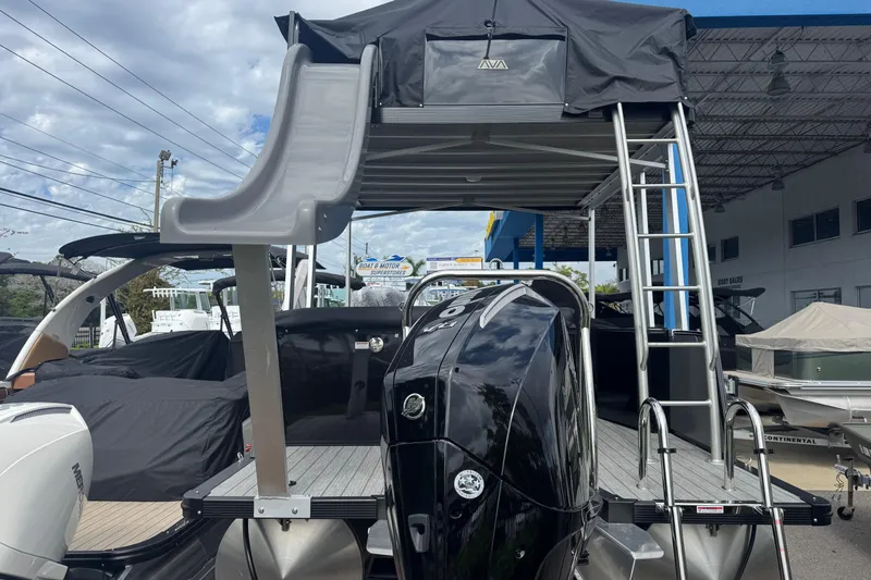 Slide: The Image of 2026 Avalon Catalina Cruise Funship 27' with slide and ladder, displayed outdoors. - 4