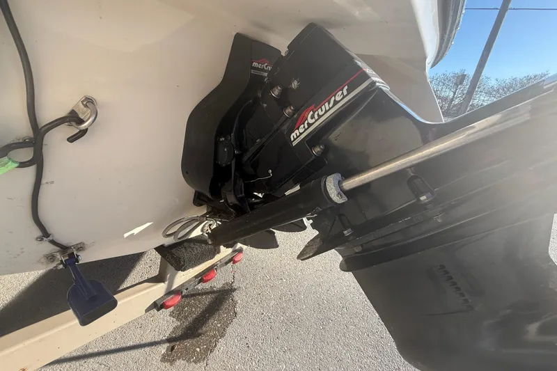 Slide: The Image of 1998 Regal 2250 LSC boat with MerCruiser outdrive, parked on a trailer. - 20