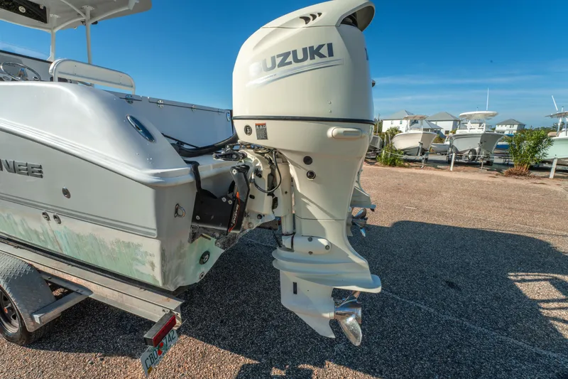 Slide: The Image of 2020 Twin Vee 240 GFX CC boat with Suzuki outboard motor on trailer. - 12