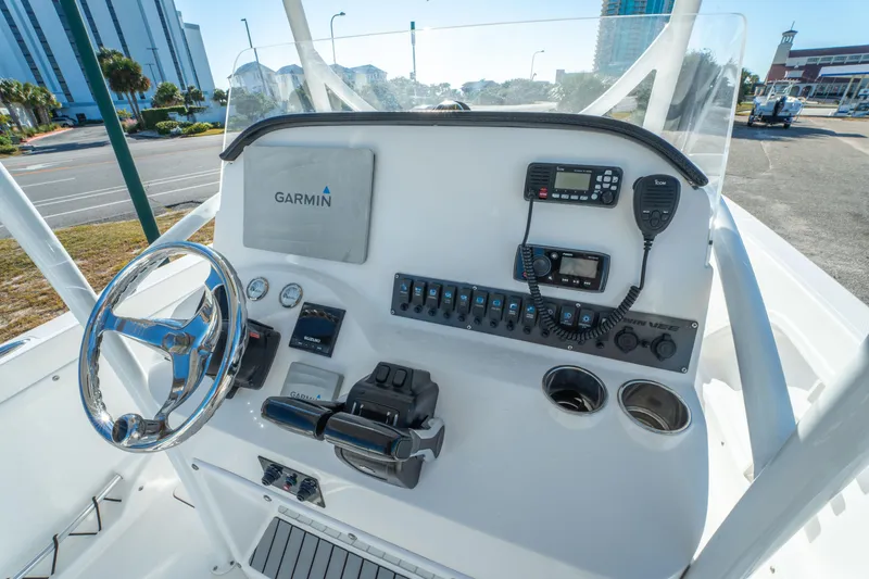 Slide: The Image of 2020 Twin Vee 240 GFX CC boat console with Garmin navigation and control panel. - 19
