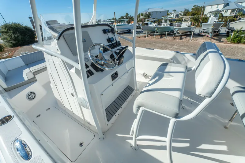 Slide: The Image of 2020 Twin Vee 240 GFX CC boat interior with steering console and seating. - 25