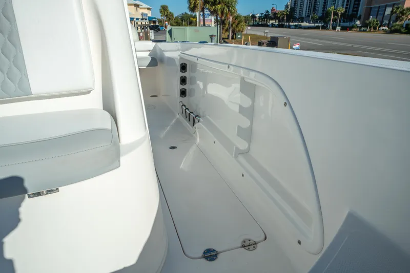 Slide: The Image of 2020 Twin Vee 240 GFX CC boat interior with seating and storage compartments. - 38