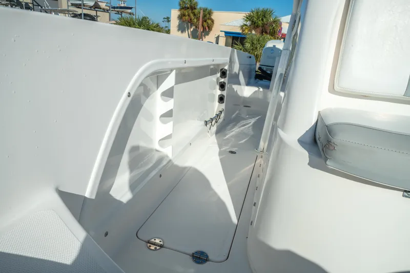 Slide: The Image of 2020 Twin Vee 240 GFX CC boat interior with seating and storage compartments. - 39