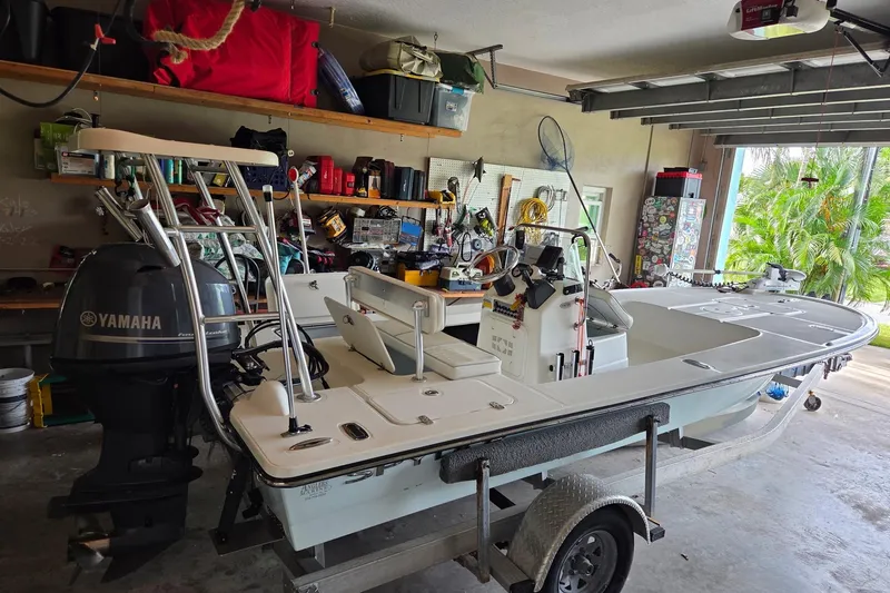 Slide: The Image of 2013 Spyder FX17 Flicker boat on trailer, displayed outdoors with sale banners. - 1