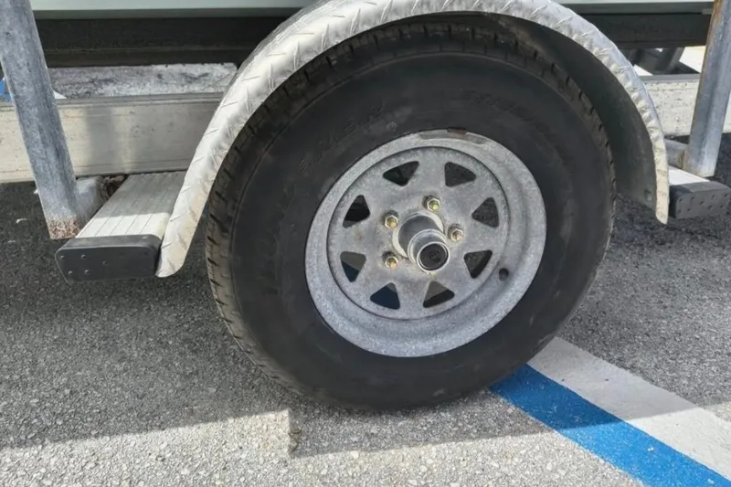 Slide: The Image of 2013 Spyder FX17 Flicker boat console with steering wheel and gauges. - 14