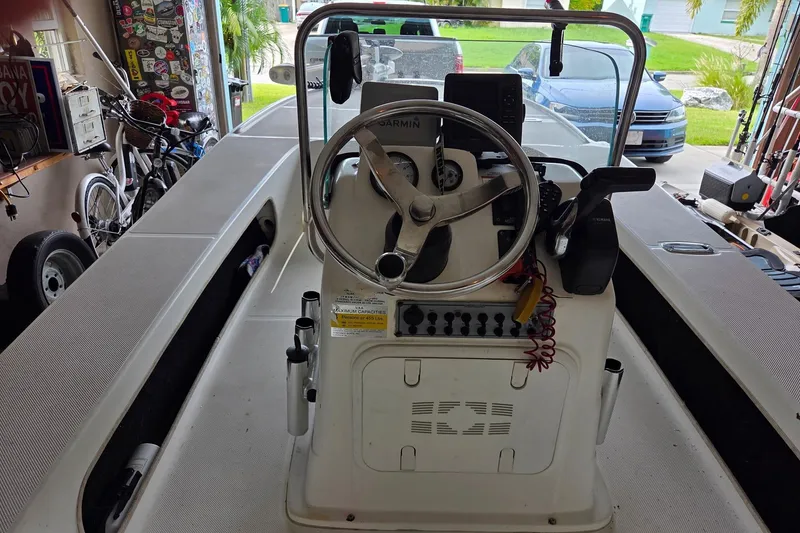 Slide: The Image of 2013 Spyder FX17 Flicker boat with Yamaha outboard motor on trailer. - 2