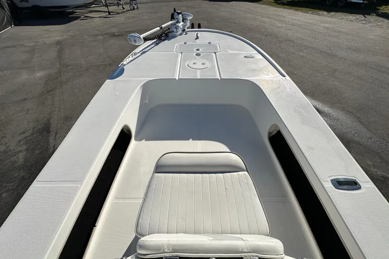 Slide: The Image of 2013 Spyder FX17 Flicker boat with white seating and deck, parked on asphalt. - 20