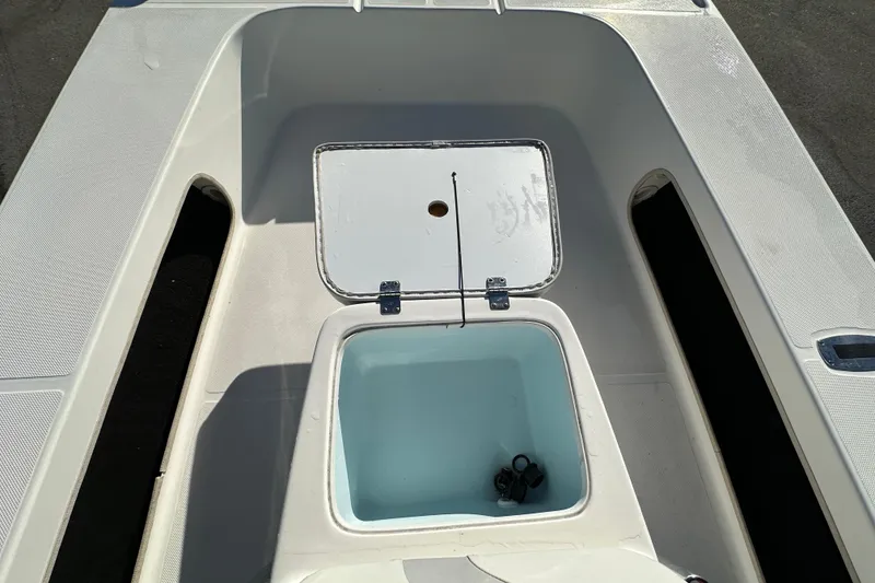Slide: The Image of 2013 Spyder FX17 Flicker boat interior with open storage compartment. - 22