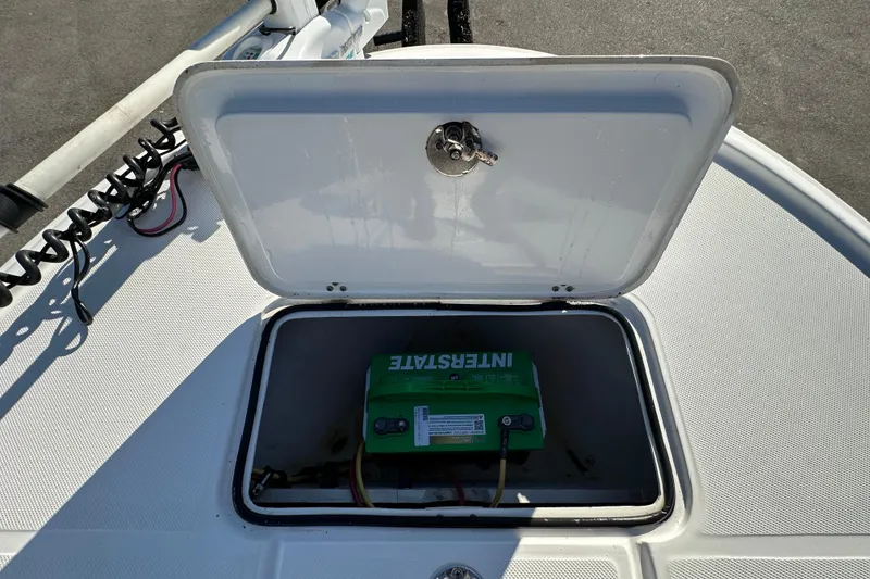 Slide: The Image of 2013 Spyder FX17 Flicker boat battery compartment with Interstate battery visible. - 24