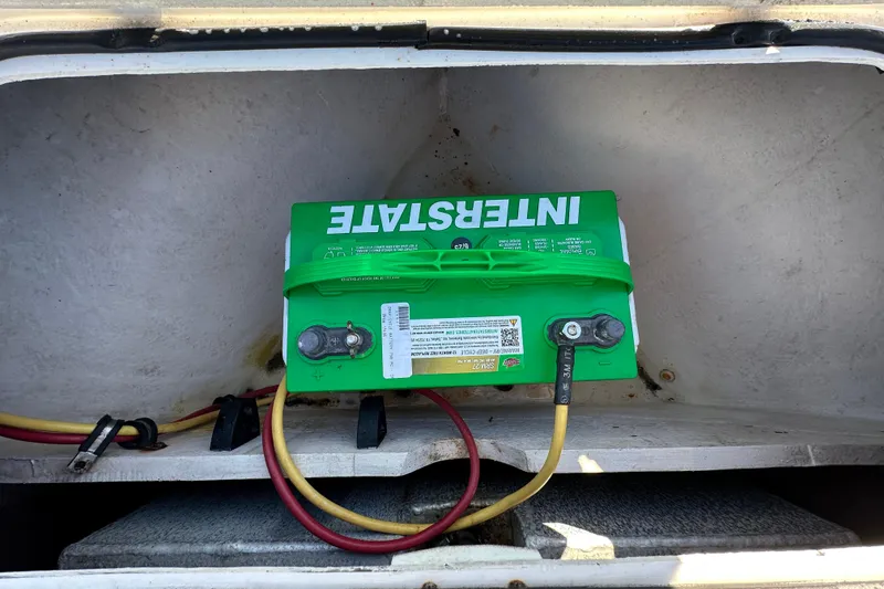 Slide: The Image of Green Interstate battery installed in a 2013 Spyder FX17 Flicker boat compartment. - 25