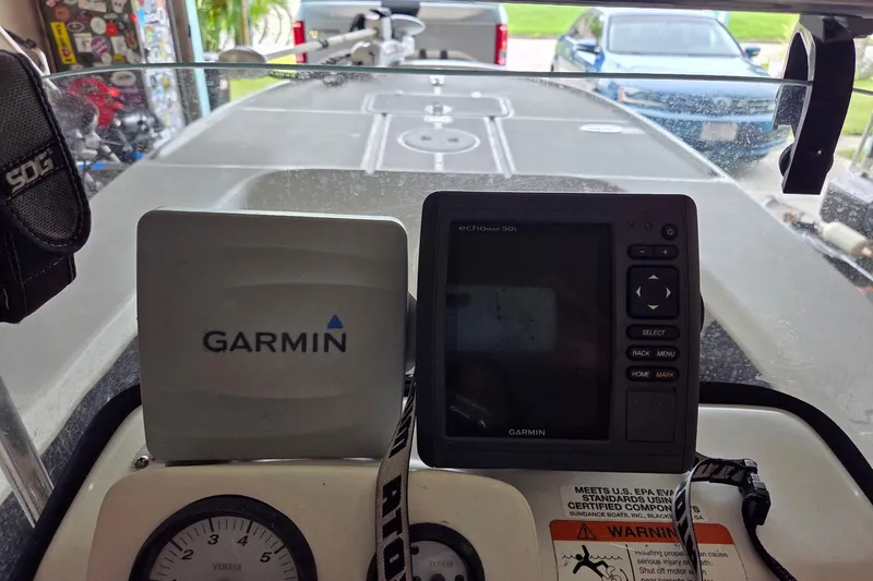 Slide: The Image of 2013 Spyder FX17 Flicker boat on trailer, displayed outdoors under clear blue sky. - 3