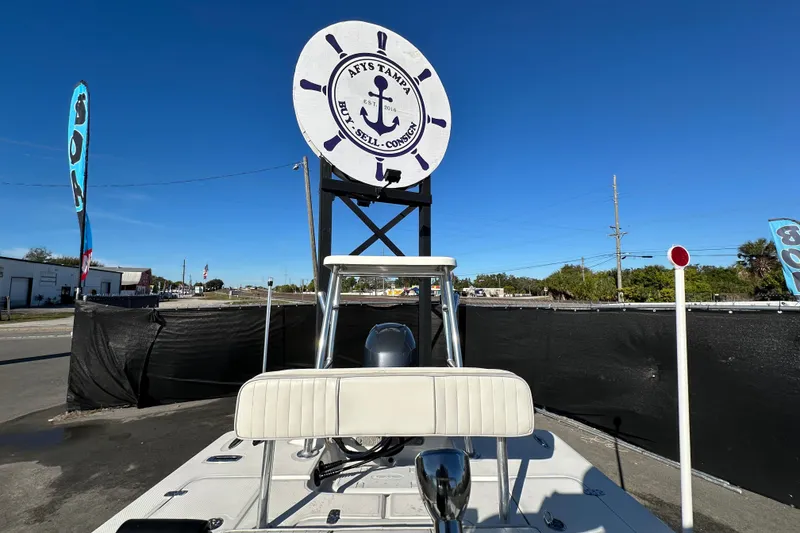 Slide: The Image of 2013 Spyder FX17 Flicker boat displayed outdoors under a clear blue sky. - 31