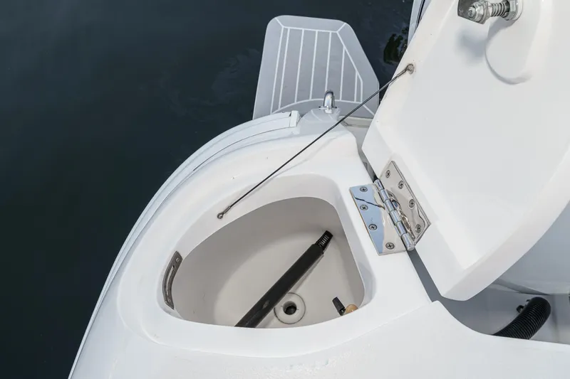 Slide: The Image of Open storage compartment on 2016 Intrepid 400 Cuddy boat, showing interior details. - 20
