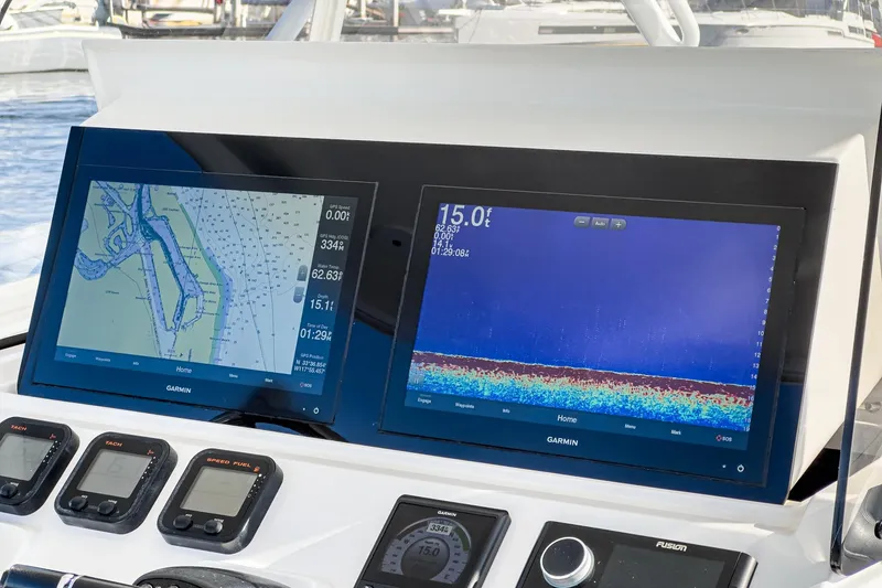 Slide: The Image of Dashboard of a 2016 Intrepid 400 Cuddy with Garmin navigation displays. - 36
