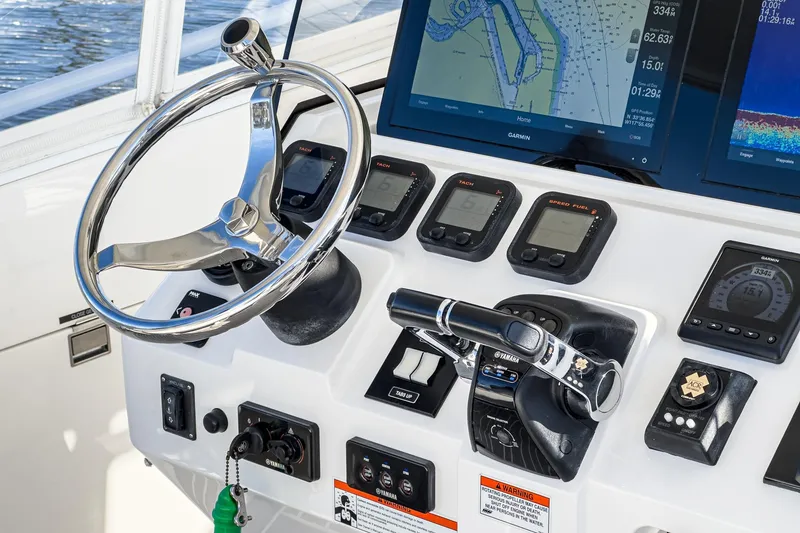 Slide: The Image of Control panel of a 2016 Intrepid 400 Cuddy boat with navigation screens and instruments. - 37