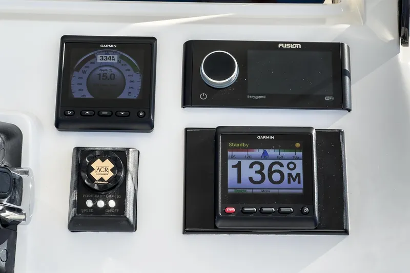 Slide: The Image of Control panel of a 2016 Intrepid 400 Cuddy with Garmin and Fusion electronics. - 38