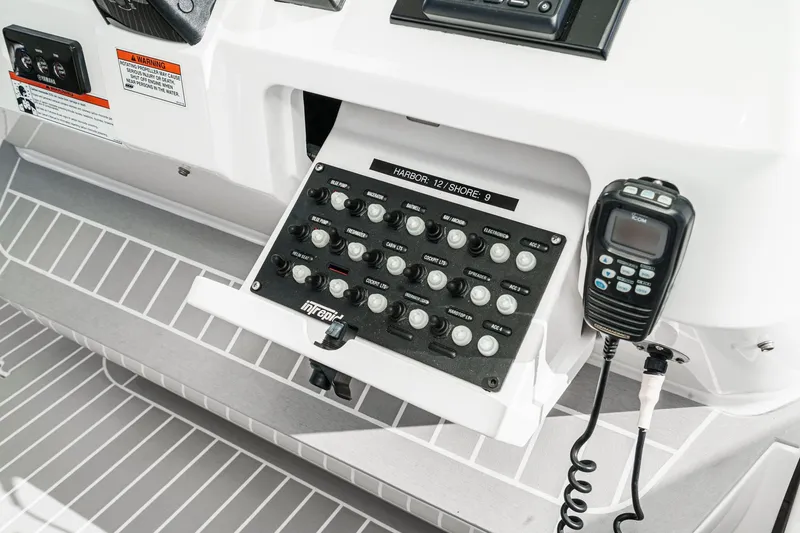 Slide: The Image of Control panel of a 2016 Intrepid 400 Cuddy boat with communication equipment. - 39