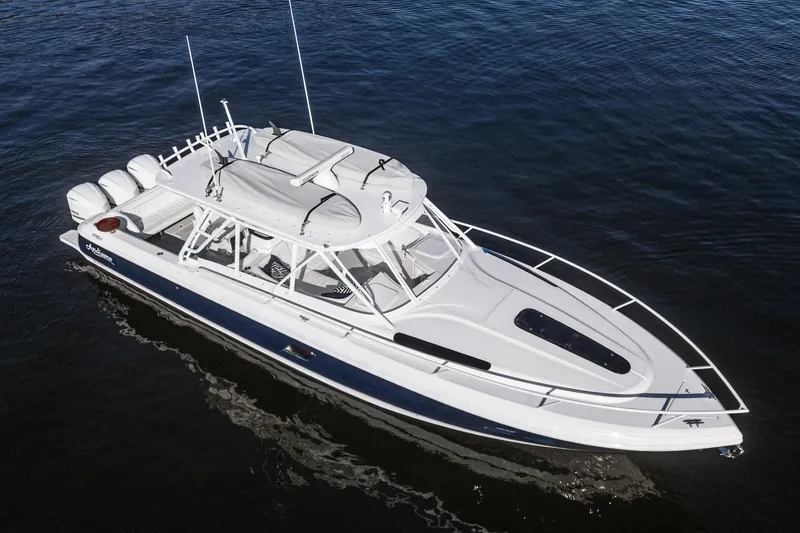 Slide: The Image of 2016 Intrepid 400 Cuddy boat on calm water, aerial view. - 4