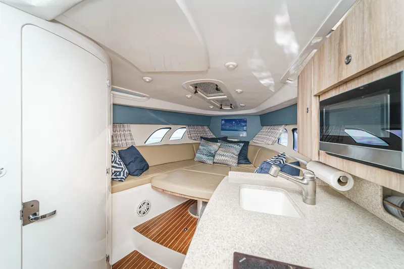 Slide: The Image of Luxurious interior of 2016 Intrepid 400 Cuddy boat with seating and kitchenette. - 51