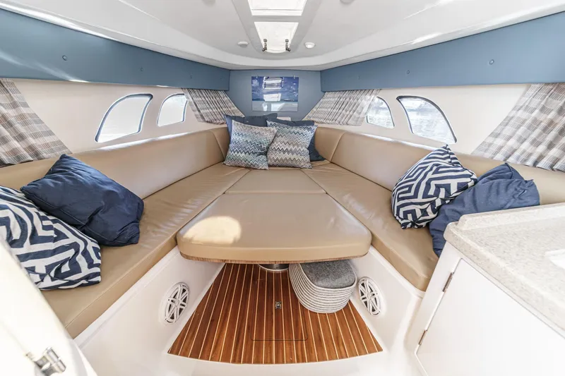 Slide: The Image of Luxurious interior of 2016 Intrepid 400 Cuddy with plush seating and stylish cushions. - 52