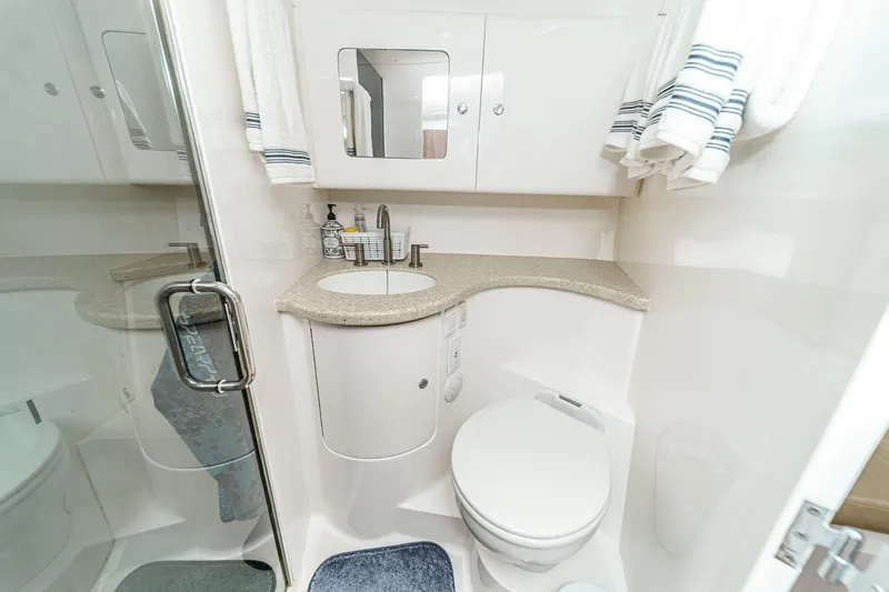 Slide: The Image of Luxurious bathroom in 2016 Intrepid 400 Cuddy boat with modern fixtures and elegant design. - 58