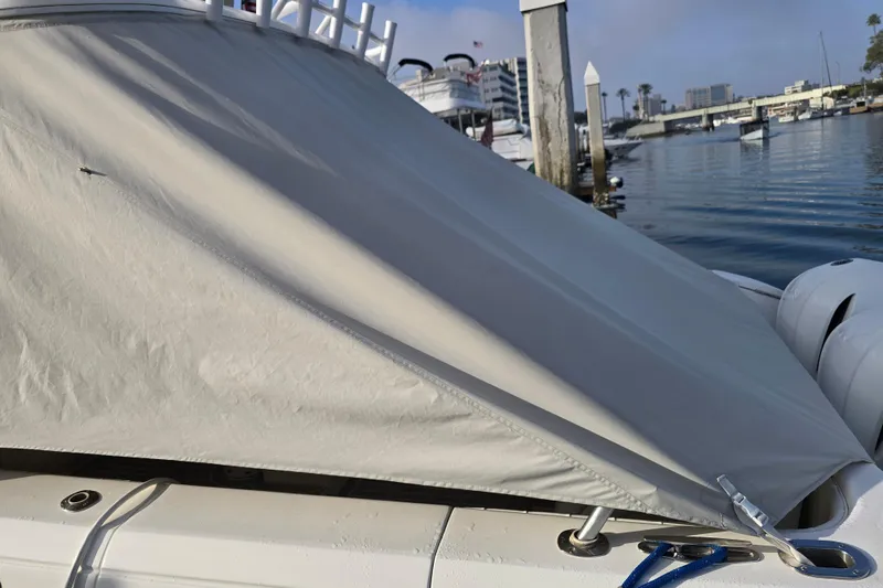 Slide: The Image of 2016 Intrepid 400 Cuddy boat with cover at marina dock. - 61