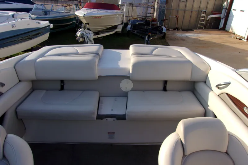 Slide: The Image of 2007 Chaparral 210 SSi boat interior with white cushioned seating. - 12