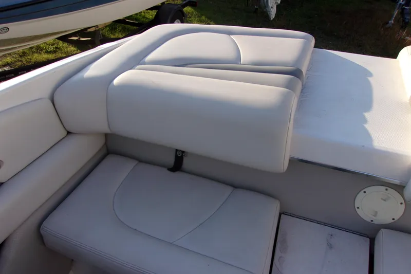 Slide: The Image of 2007 Chaparral 210 SSi boat interior seating with white upholstery. - 13