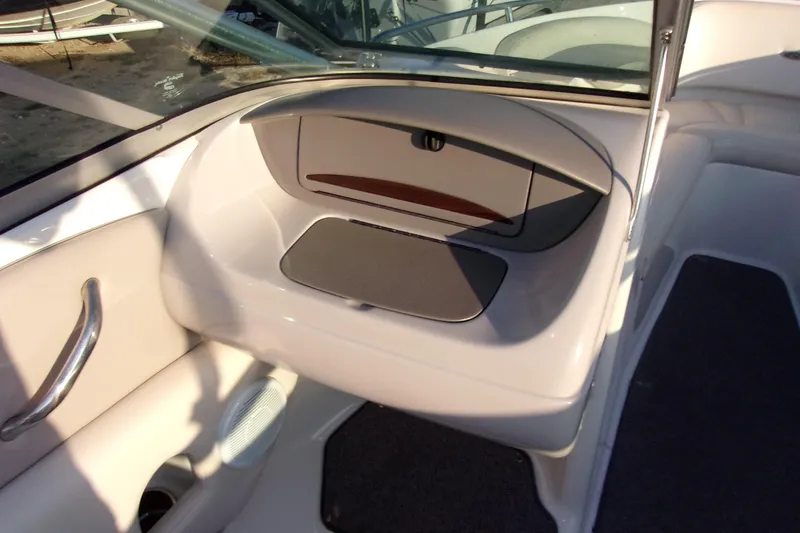 Slide: The Image of 2007 Chaparral 210 SSi boat interior with storage compartment and sleek design. - 6