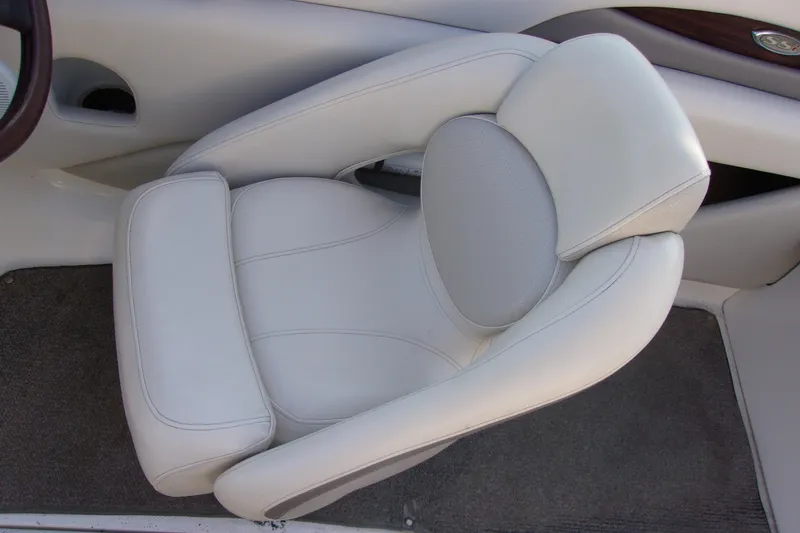 Slide: The Image of 2007 Chaparral 210 SSi boat interior with white cushioned seat and carpeted floor. - 7