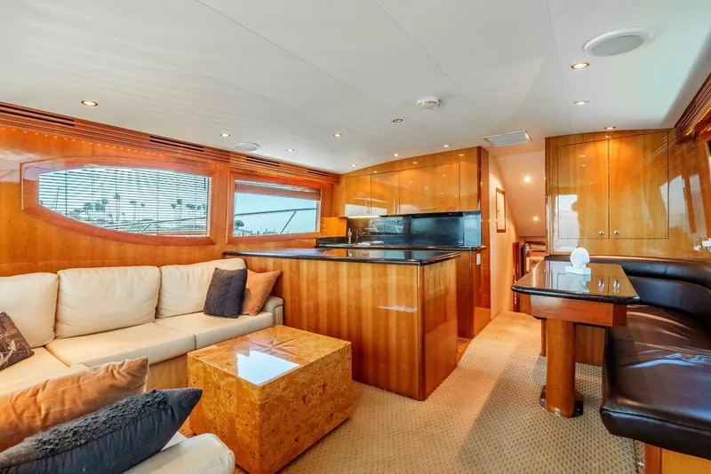 Slide: The Image of Luxurious interior of 2004 Hatteras 54 Convertible yacht with elegant wood finishes and plush seating. - 10