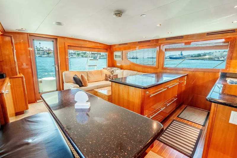 Slide: The Image of Luxurious interior of 2004 Hatteras 54 Convertible yacht with elegant wood finishes and waterfront views. - 12