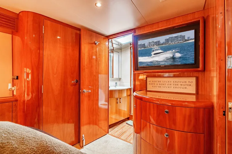 Slide: The Image of Luxurious interior of 2004 Hatteras 54 Convertible yacht with polished wood finish. - 19