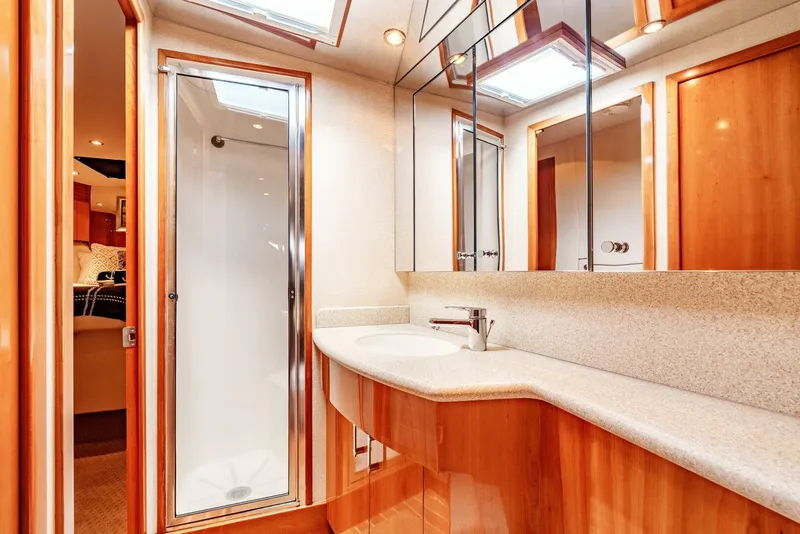 Slide: The Image of Luxurious bathroom interior of 2004 Hatteras 54 Convertible yacht with modern fixtures. - 24
