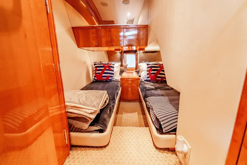 Slide: The Image of Luxurious cabin interior of 2004 Hatteras 54 Convertible yacht with twin beds. - 25