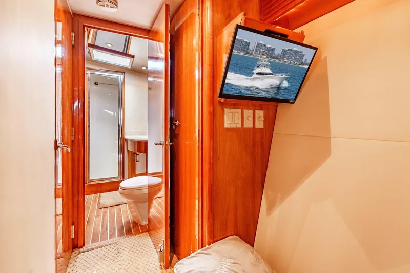 Slide: The Image of Interior of 2004 Hatteras 54 Convertible yacht with bathroom and mounted TV. - 27