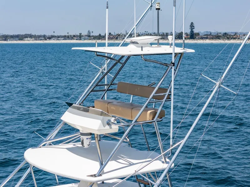 Slide: The Image of 2004 Hatteras 54 Convertible yacht tower with ocean backdrop. - 39