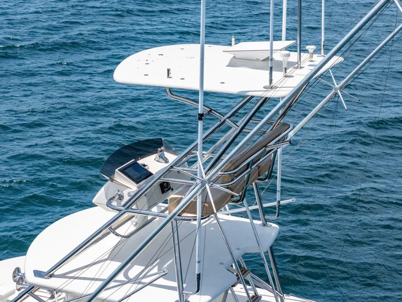 Slide: The Image of 2004 Hatteras 54 Convertible yacht tower with ocean backdrop. - 40