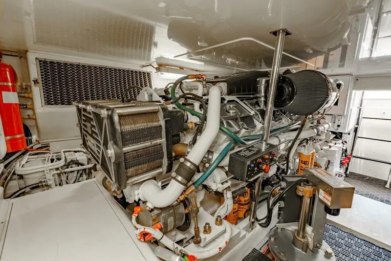 Slide: The Image of Engine room of 2004 Hatteras 54 Convertible yacht, showcasing detailed machinery and components. - 45