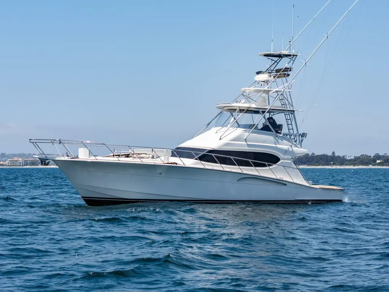 Slide: The Image of 2004 Hatteras 54 Convertible yacht cruising on open water. - 46
