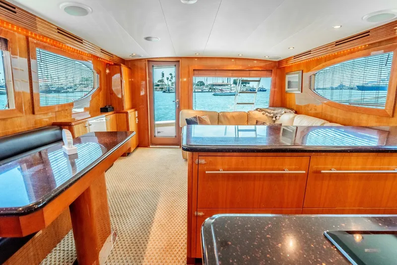 Slide: The Image of Luxurious interior of 2004 Hatteras 54 Convertible yacht with elegant wood finishes and waterfront view. - 7