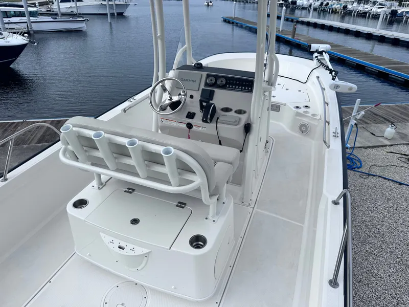 Slide: The Image of Boston Whaler 210 Montauk 2023 at a serene marina. - 13